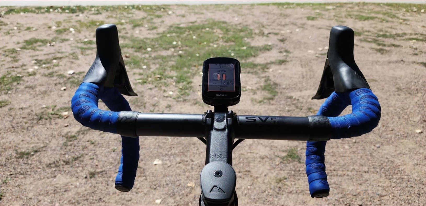 N'AERO drop bar fitted with a head unit, photographed from the rider's view on gravel